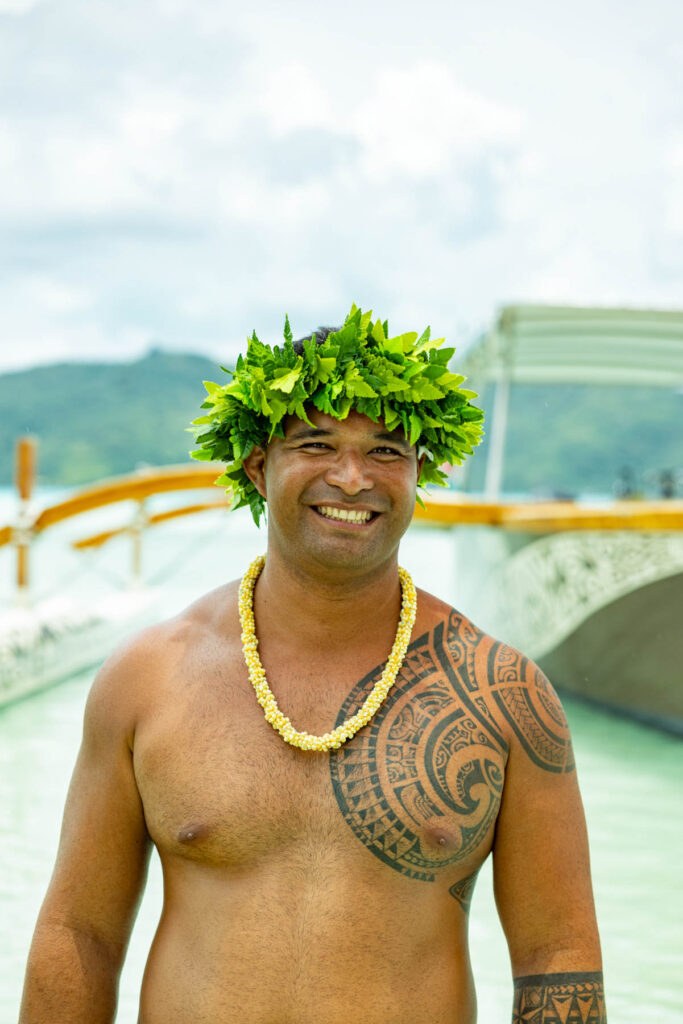 Guy with a Polynesian tattoo on his chest