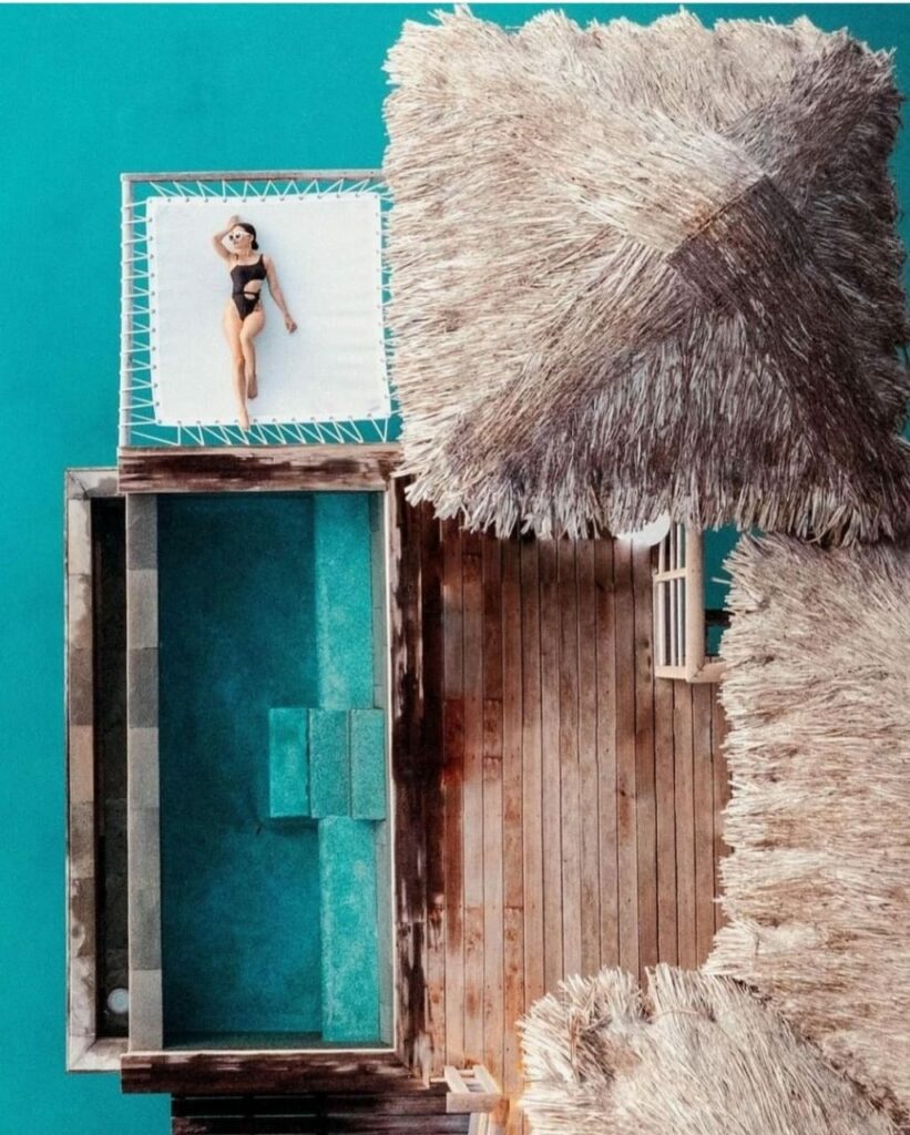 Aerial view of an overwater bungalow at the Four Seasons Bora Bora