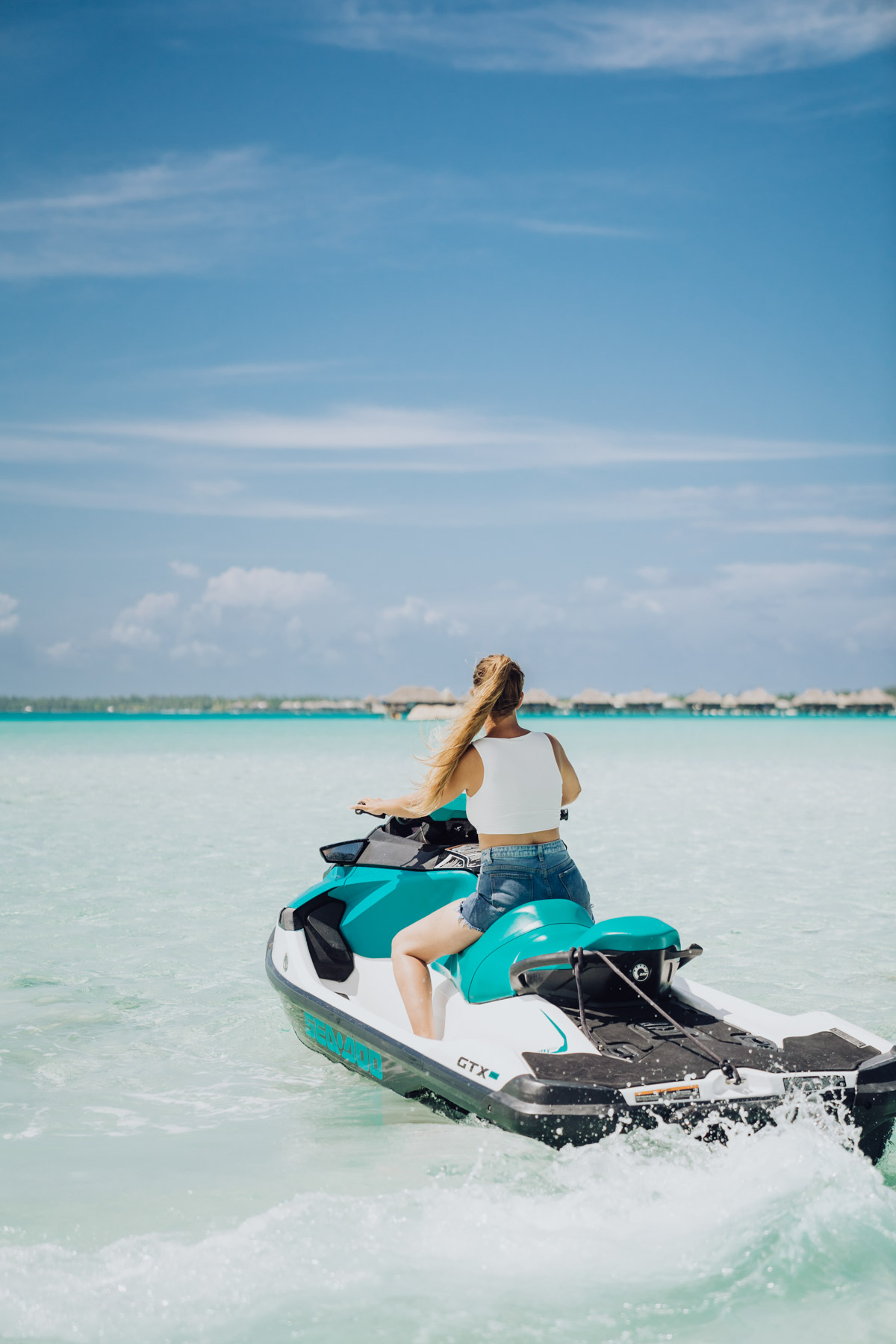 a woman riding a jet ski in Bora Bora