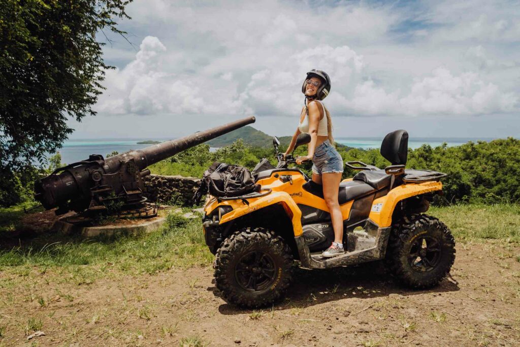 A woman riding an ATV in Bora Bora