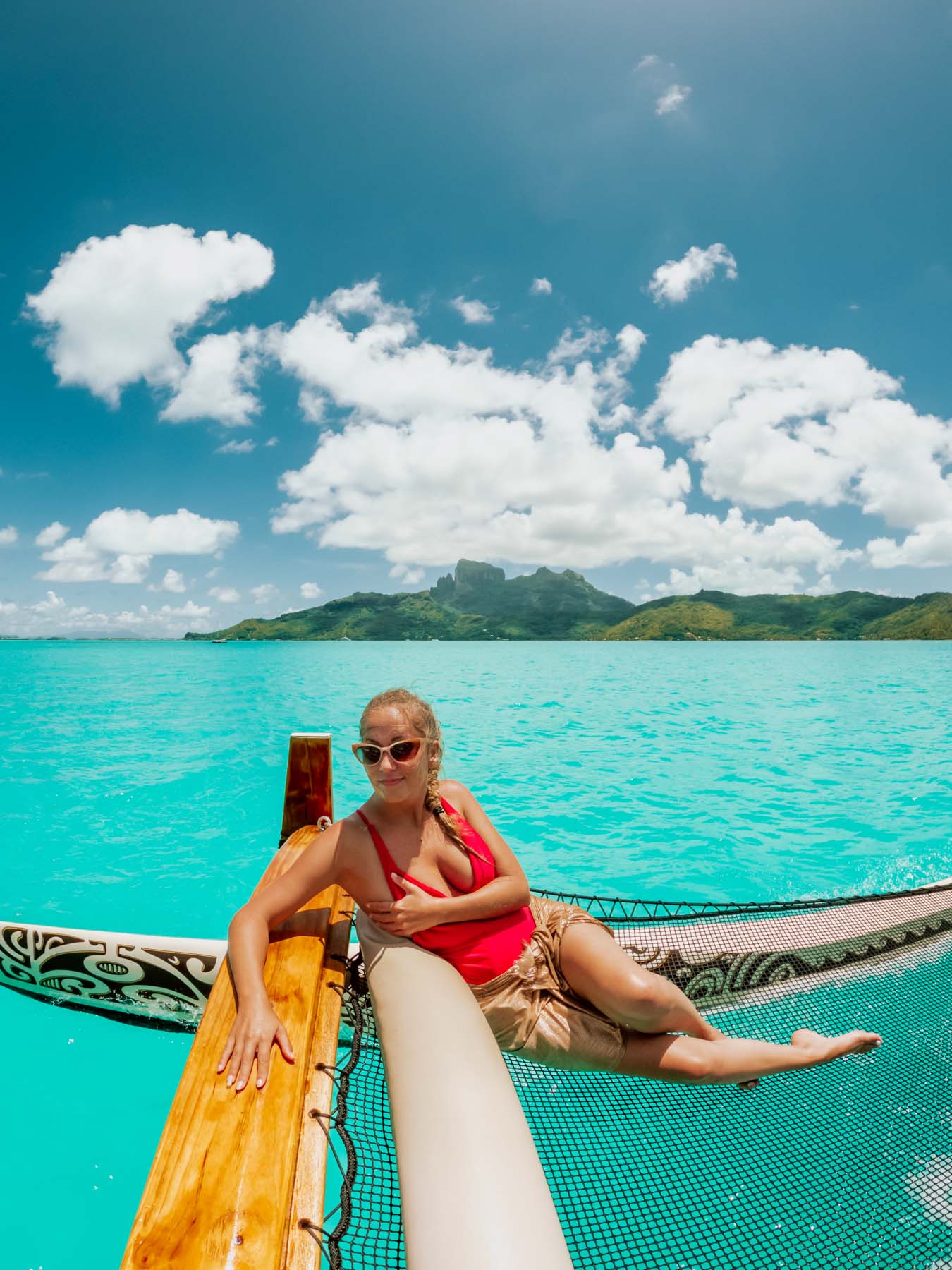 Girl on a traditional boat in Bora Bora