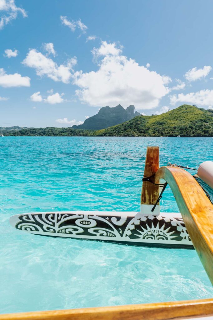 Traditional polynesian boat with Bora Bora moutain on the back