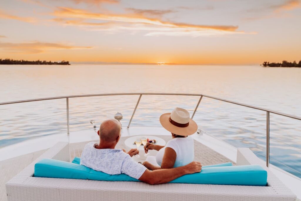 A couple having a sunset cruise in Bora Bora